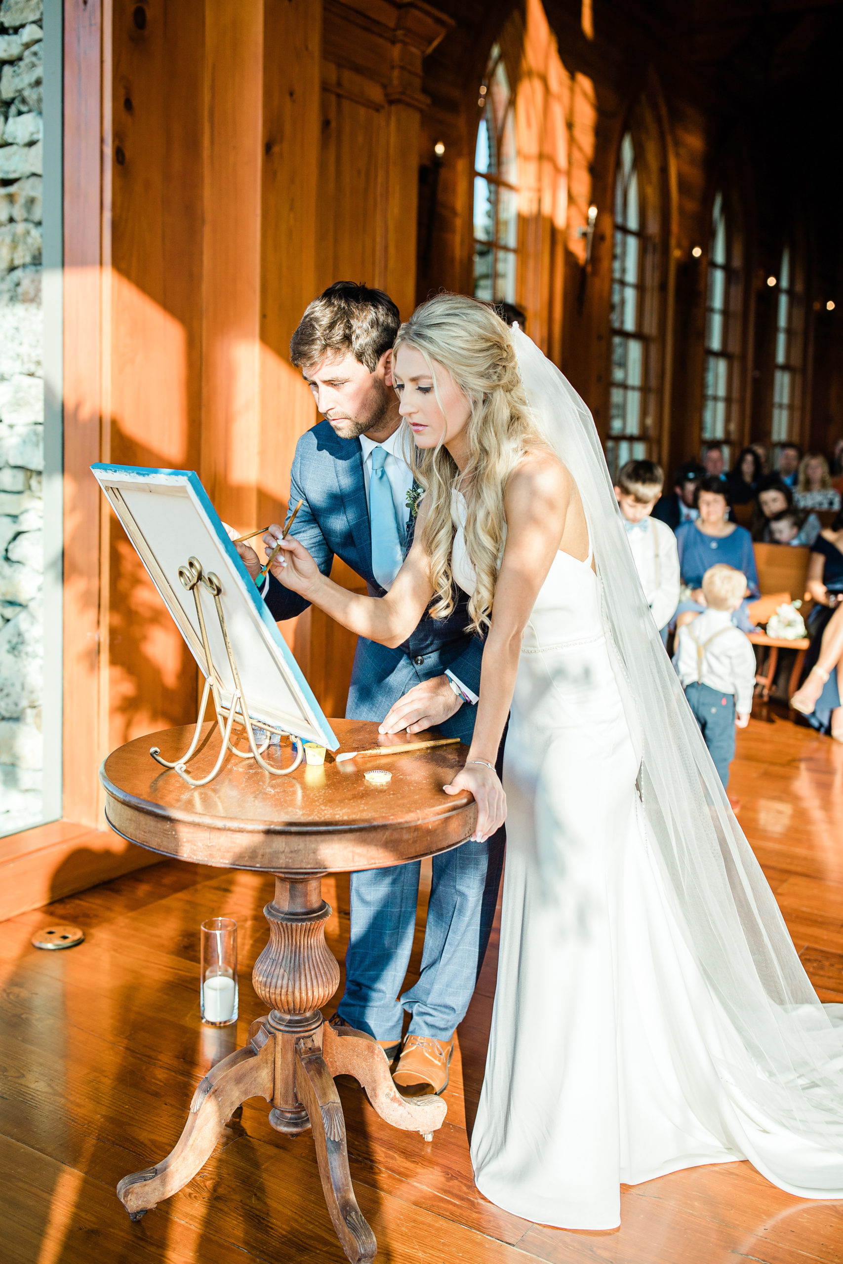 Bride and groom painting during their ceremony exchange