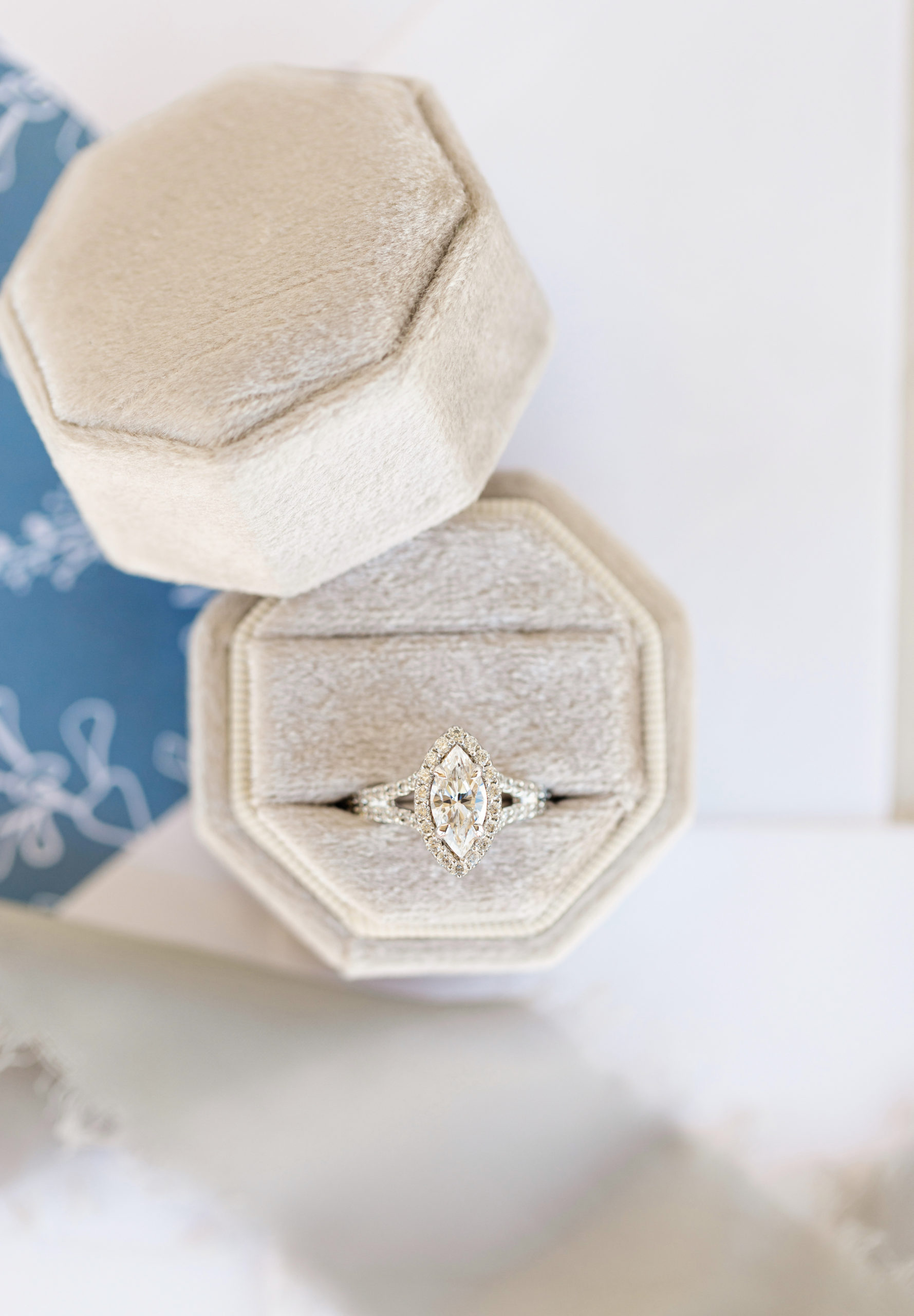 Close-up shot of wedding ring inside beige box