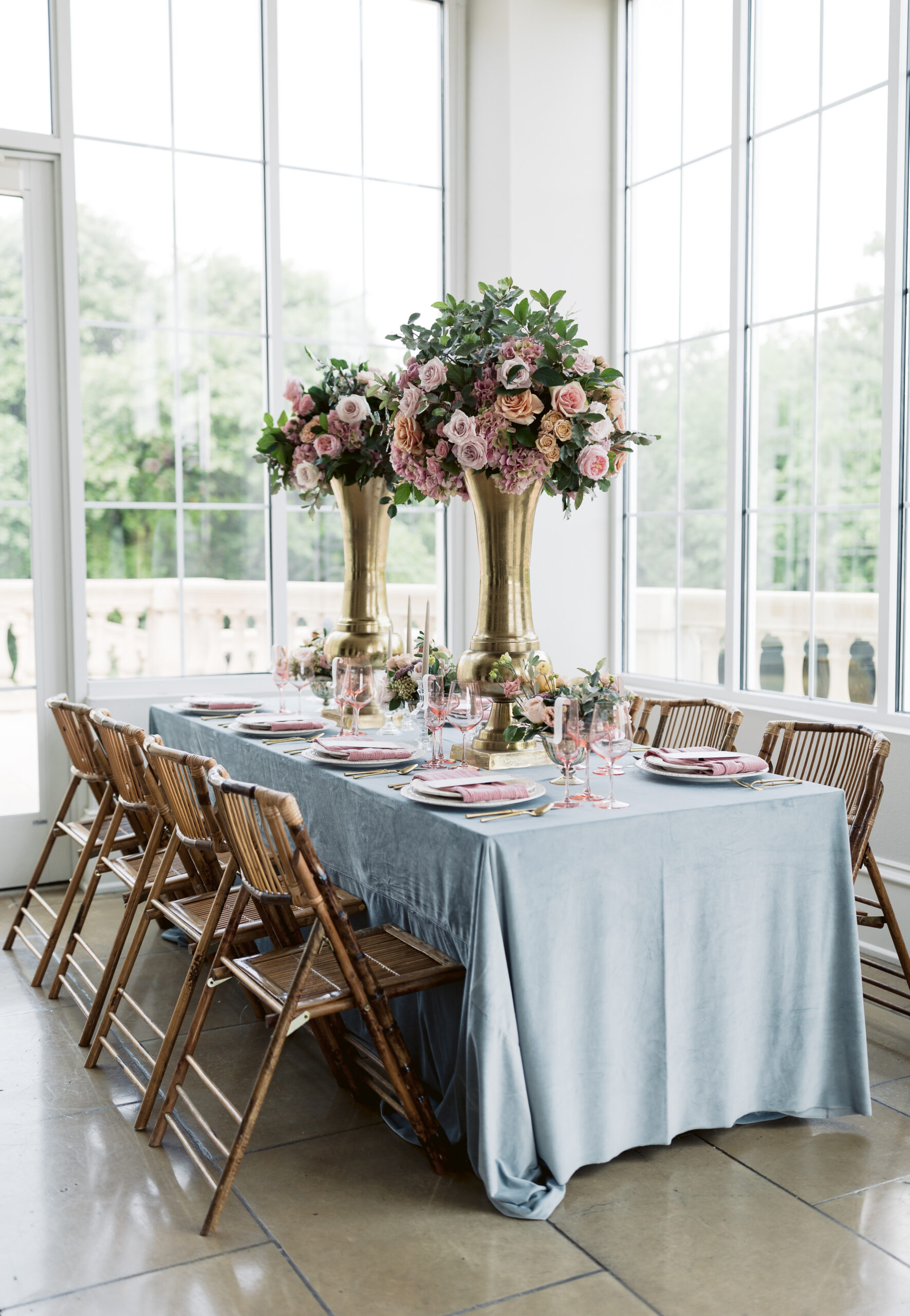 Flat-lay shot of menu planed on pink napkin and plates with gold utensils, shot by fine art wedding photographer Tatyana Zadorin