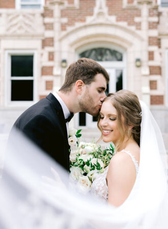 bride and groom portrait kissing