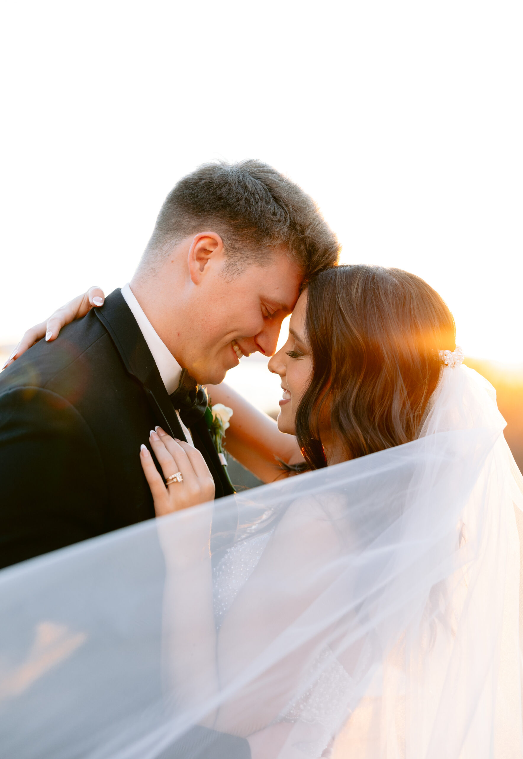 Bride and groom close-up golden hour portrait photographed by Tatyana Zadorin Photography. Springfield MO wedding photography