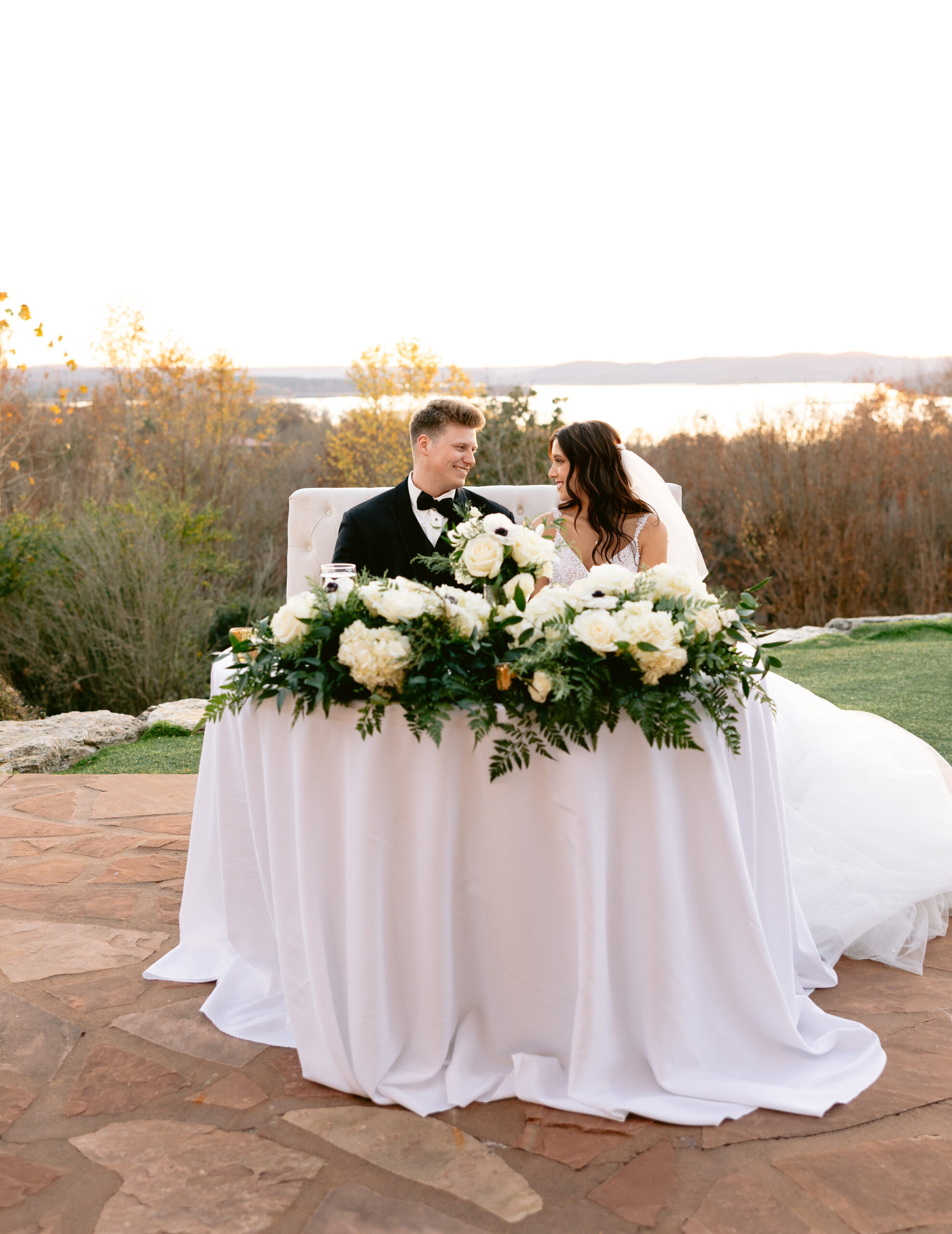 Bride and groom sitting at the head table photographed by Tatyana Zadorin Photography