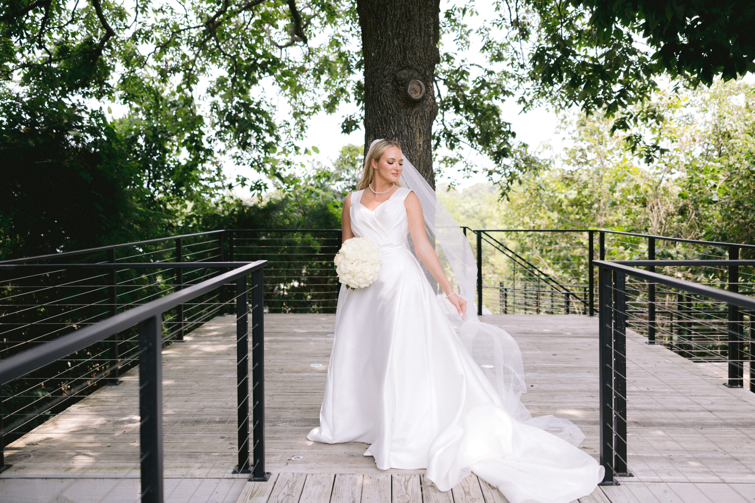Bridal portrait shot by Tatyana Zadorin Photography at the Greenhouse two rivers. Branson, MO wedding photographer. Bride in her wedding dress