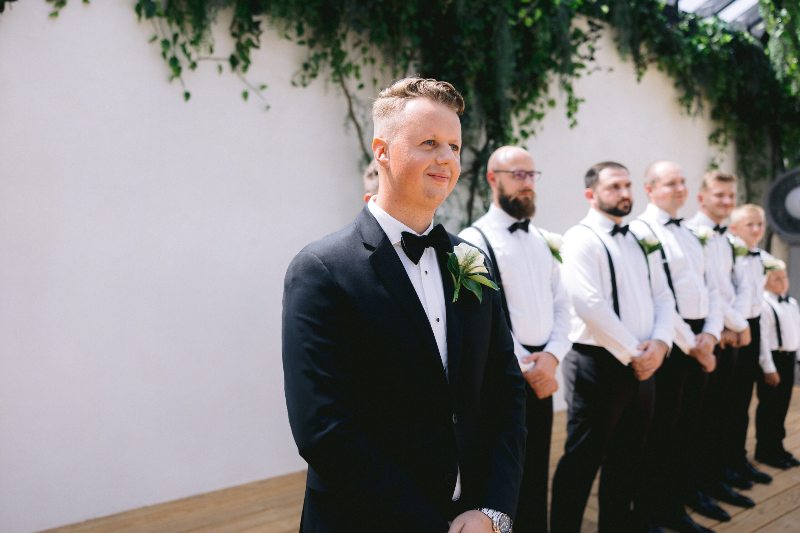 Groom looking at his bride walking down the aisle photographed by Tatyana Zadorin Photography