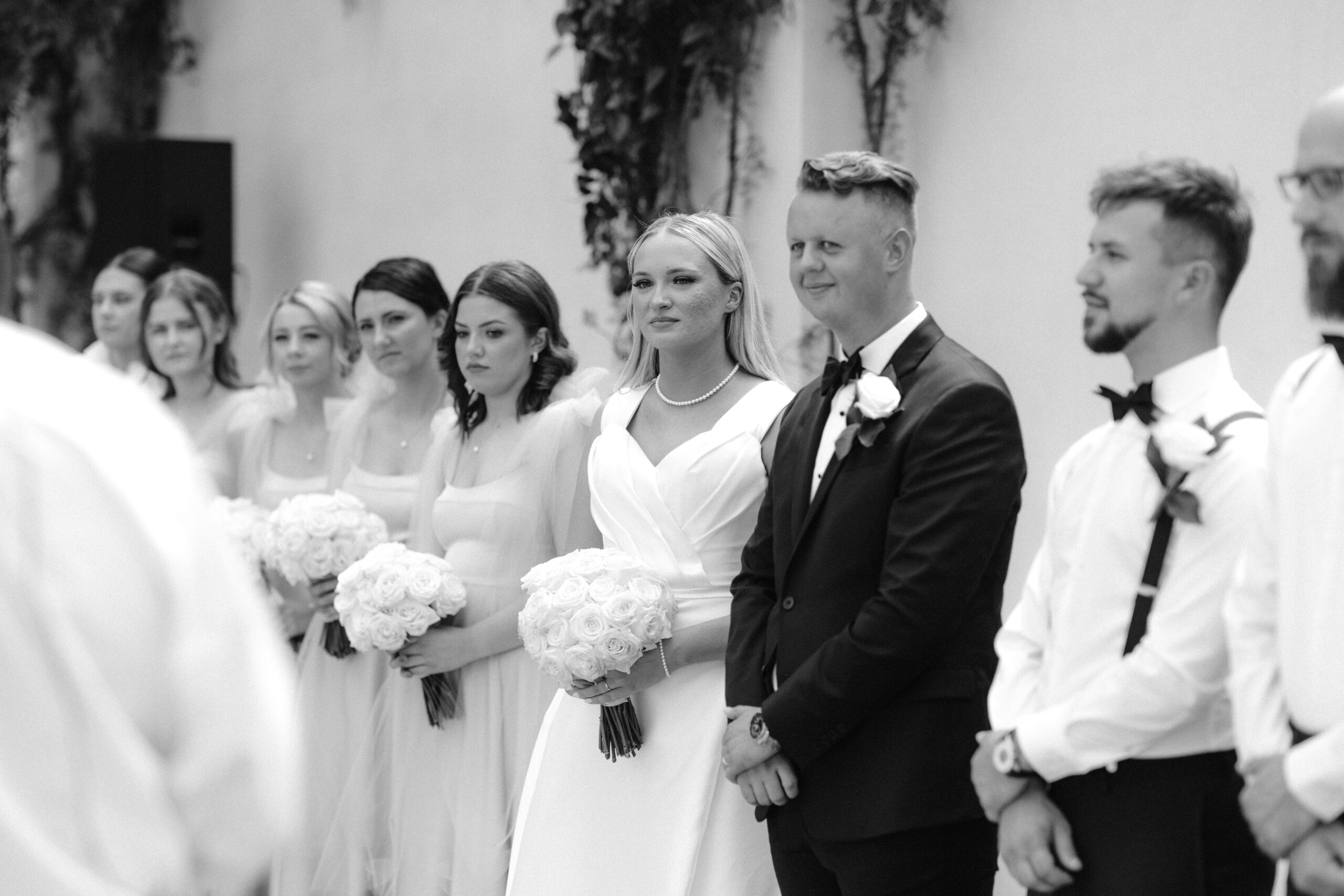 Bride and groom at the alter. Black and white portrait. Photographed by Tatyana Zadorin Photography at the Greenhouse Two Rivers