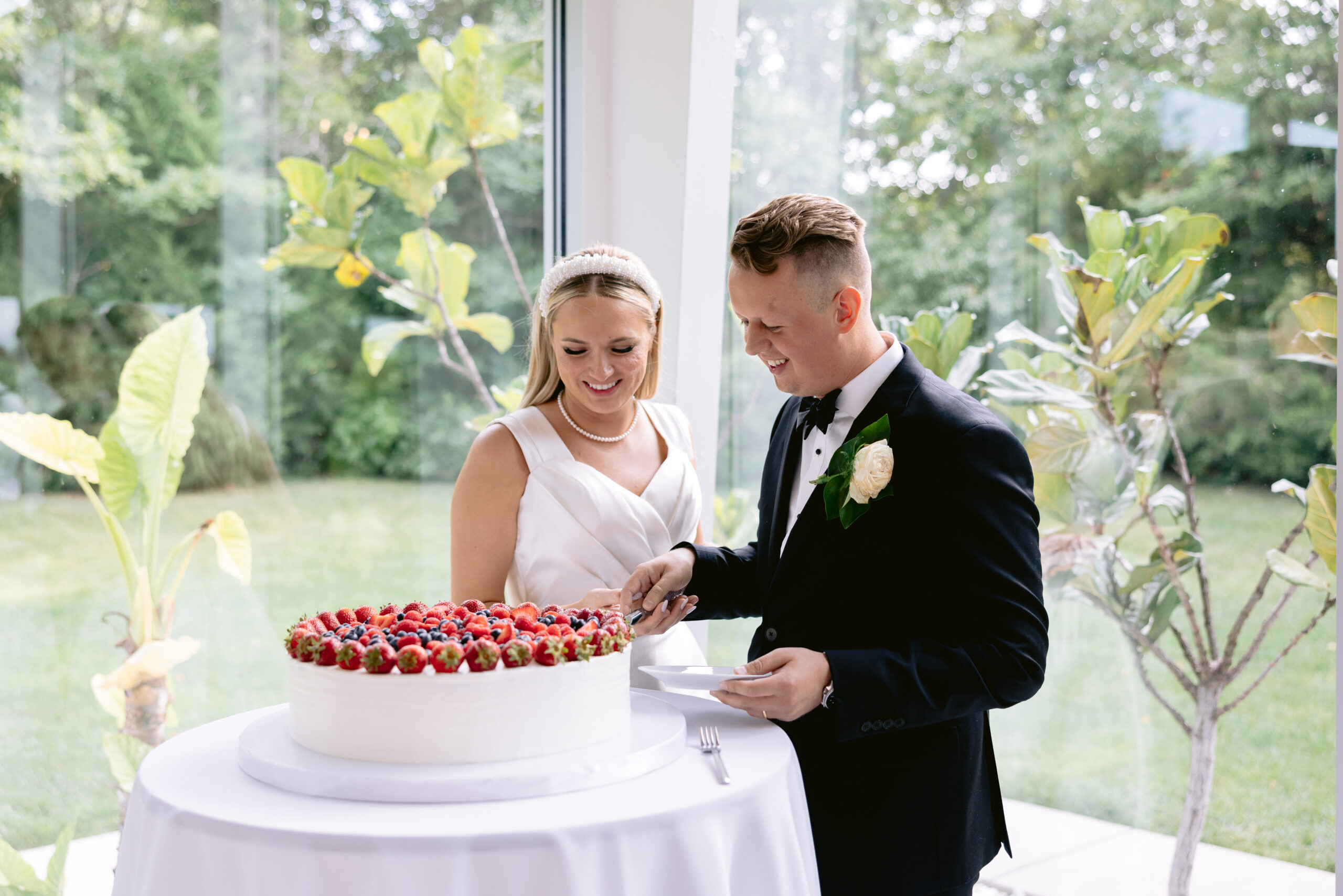 Bride and groom cutting the cake shot by Tatyana Zadorin Photography