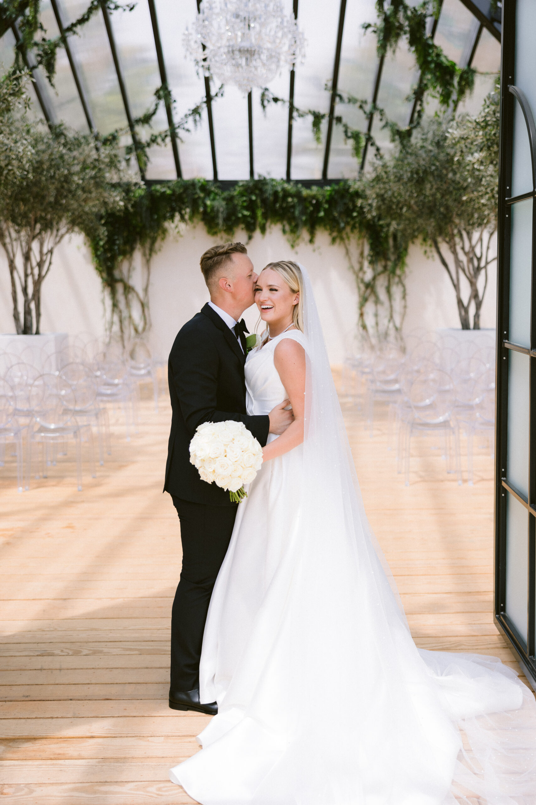 Bride and groom happily married looking at each other portrait photographed by Tatyana Zadorin Photography. Greenhouse Two rivers wedding venue