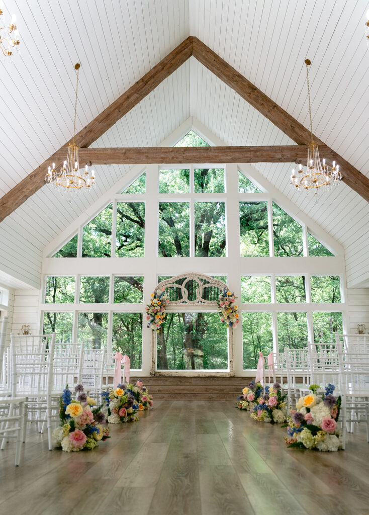 Elegant venue details at The French Farmhouse in Collinsville, Texas featuring the white chapel, reception building, bright ceremony space with vaulted ceilings, timeless bridal suite décor, and charming wedding duck decorations.