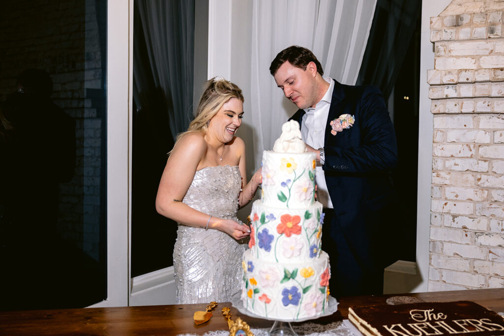 Elegant wedding reception toasts featuring heartfelt speeches, joyful laughter from the bride and groom, emotional guest reactions, and beautifully decorated sweetheart table at The French Farmhouse wedding venue in Collinsville, Texas.